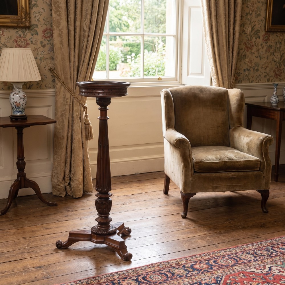 A 19th-century carved oak plant stand featuring a circular dish top, fluted central column, and a tripod base with carved scroll feet. View III