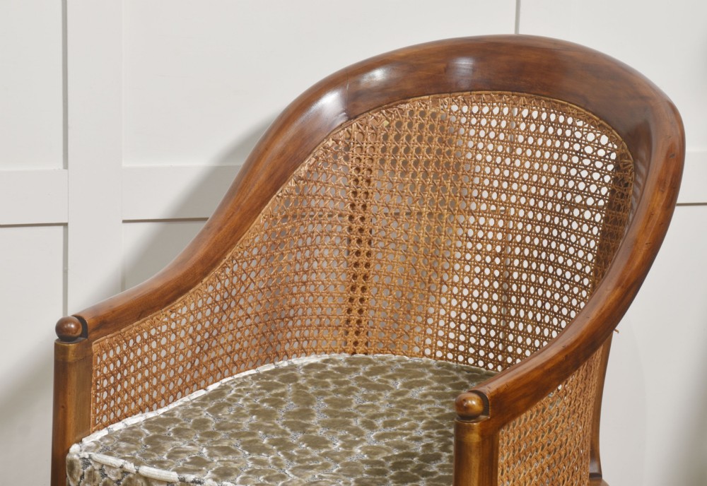 Pair of Regency style mahogany tub chairs featuring woven cane backs, upholstered cushions, turned legs, and brass castors. View VII