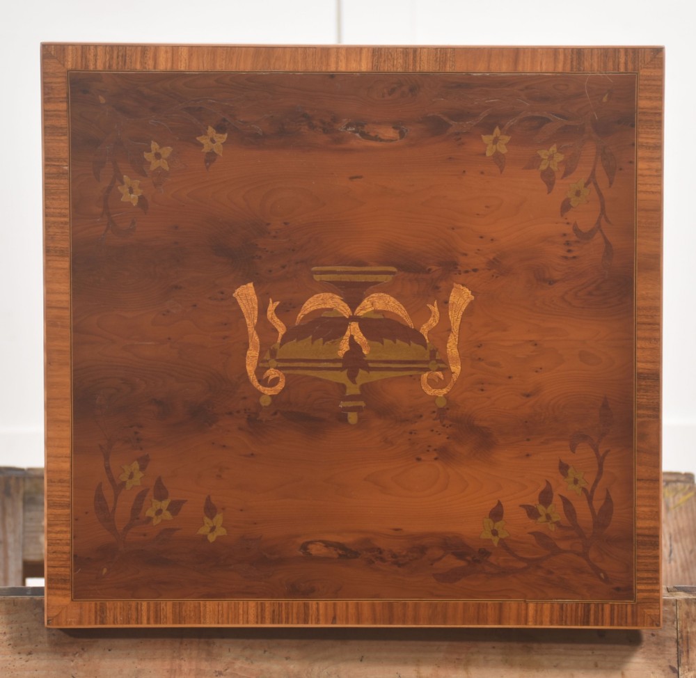 A matching pair of tall, slim mahogany Sheraton style bedside cabinets featuring floral marquetry inlay on single cupboard doors and square tapered legs. View II