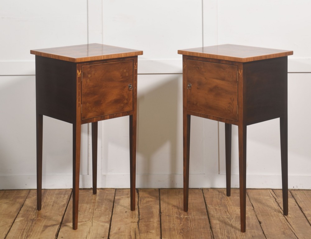 A matching pair of tall, slim mahogany Sheraton style bedside cabinets featuring floral marquetry inlay on single cupboard doors and square tapered legs. View IV