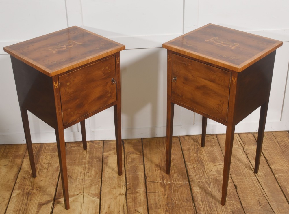 A matching pair of tall, slim mahogany Sheraton style bedside cabinets featuring floral marquetry inlay on single cupboard doors and square tapered legs. View VII
