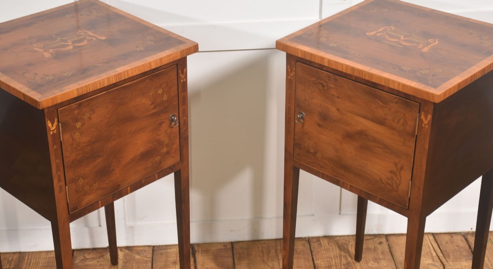 A matching pair of tall, slim mahogany Sheraton style bedside cabinets featuring floral marquetry inlay on single cupboard doors and square tapered legs. View VIII