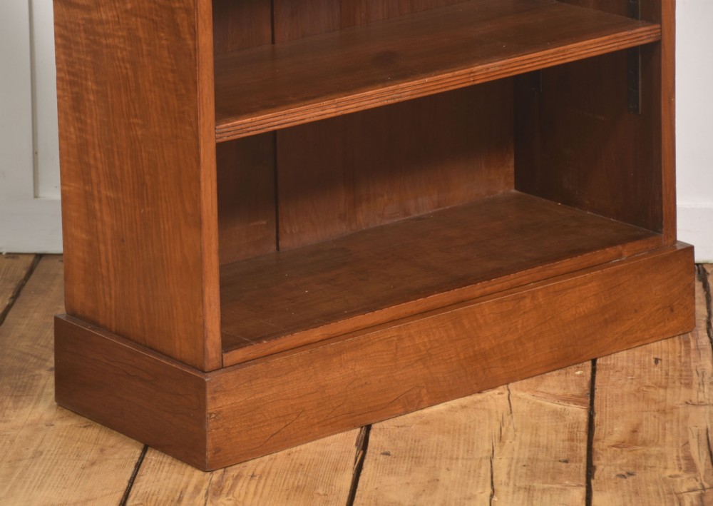 A pair of low burr walnut open bookcases featuring brass galleries along the top and adjustable interior shelves. View IX