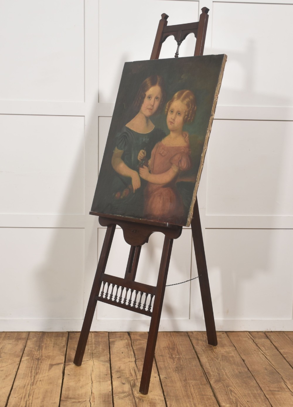 A dark walnut A-frame artist easel featuring Gothic Revival pointed arches, turned spindle galleries, and an adjustable support ledge. View VII