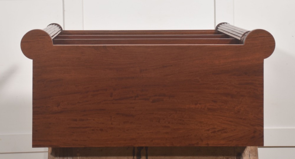 A pair of low mahogany open bookcases featuring fluted pilasters with carved tops, adjustable shelves, and turned legs. View XII