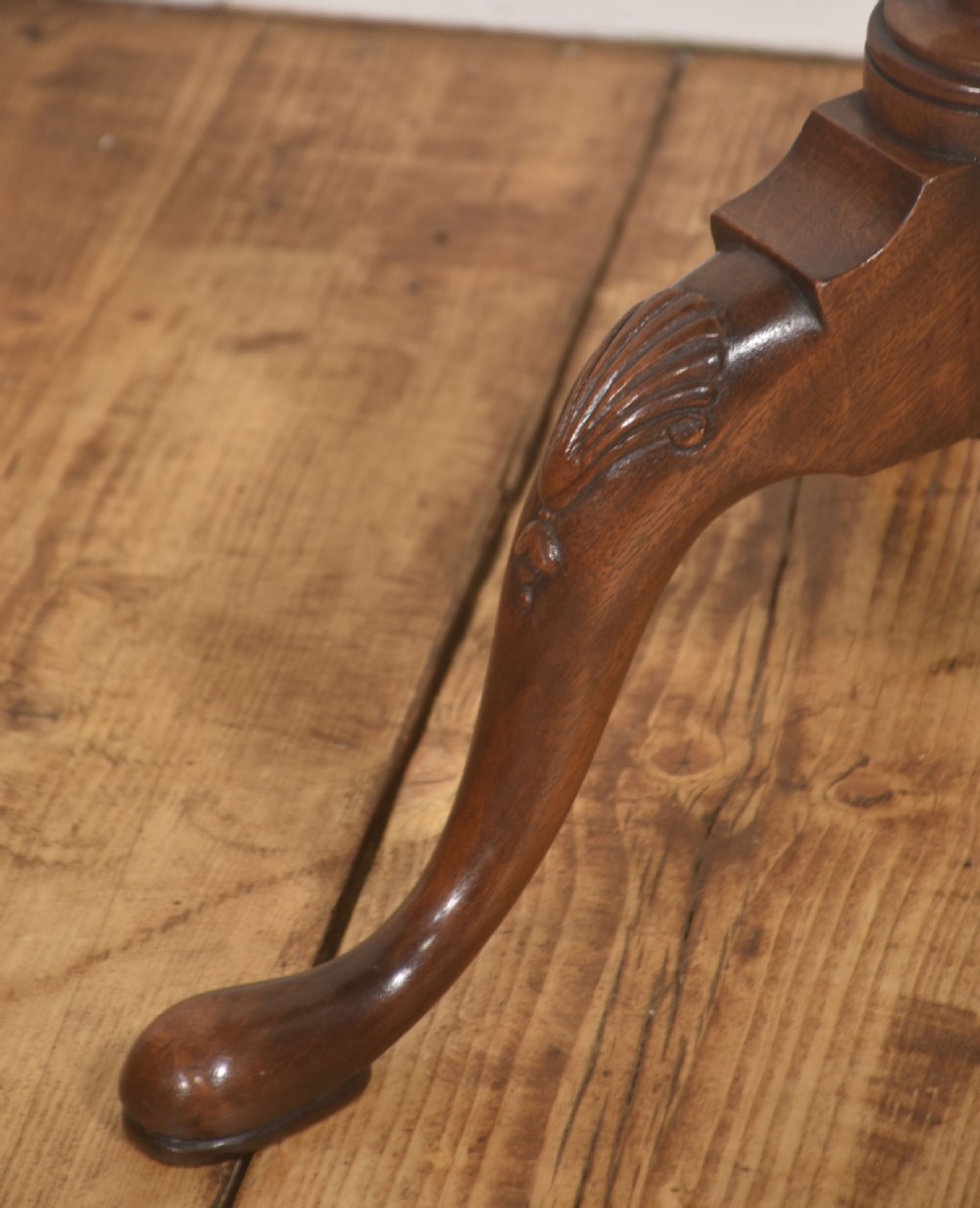 A pair of polished dark mahogany tripod side tables featuring scalloped pie-crust tops, turned central pedestals, and carved cabriole legs. View V