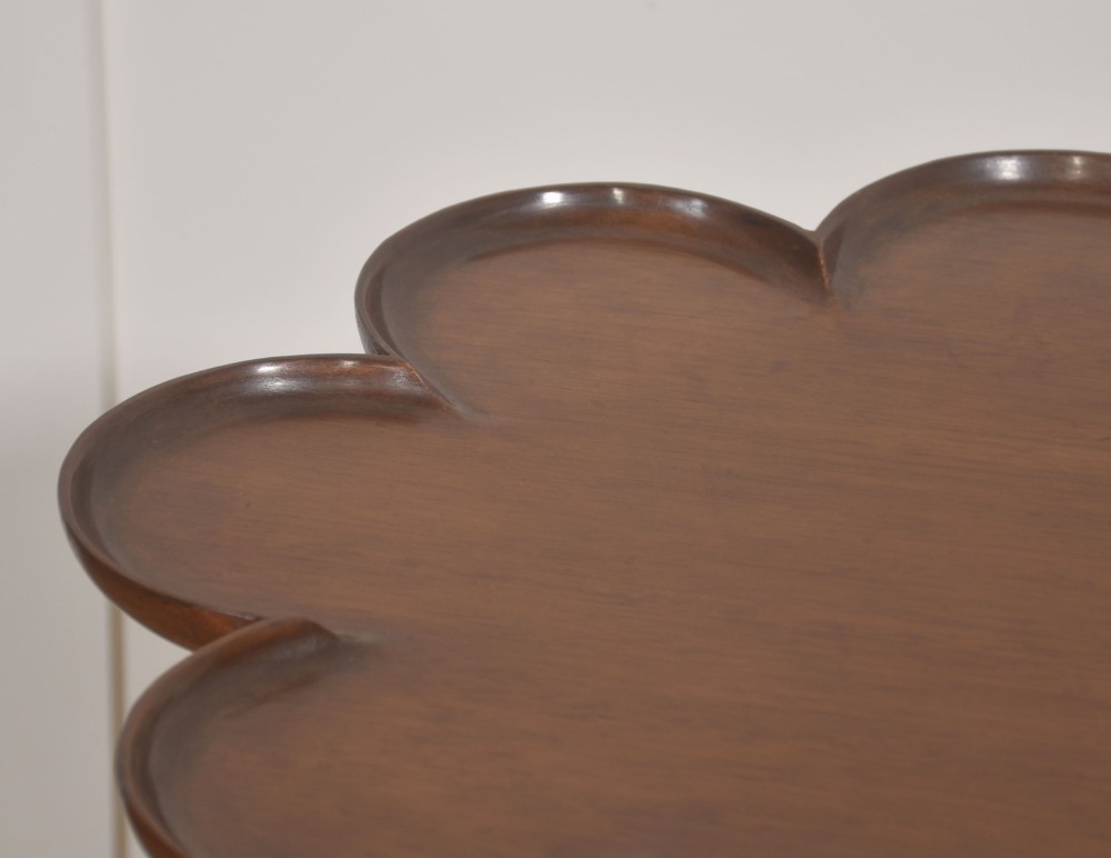 A pair of polished dark mahogany tripod side tables featuring scalloped pie-crust tops, turned central pedestals, and carved cabriole legs. View VI