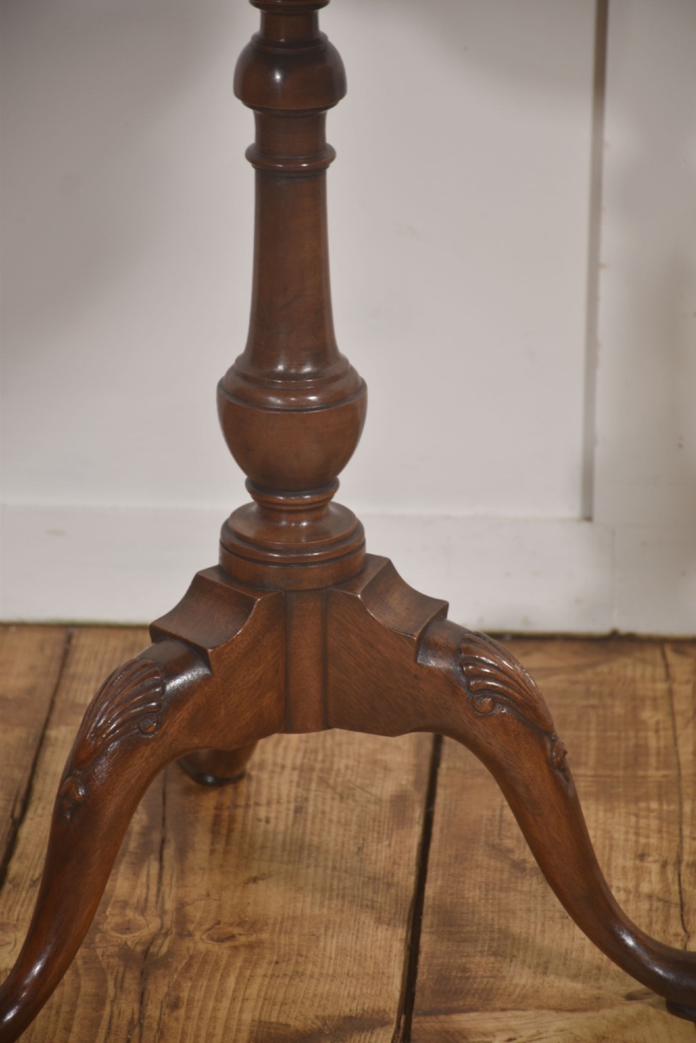 A pair of polished dark mahogany tripod side tables featuring scalloped pie-crust tops, turned central pedestals, and carved cabriole legs. View VIII