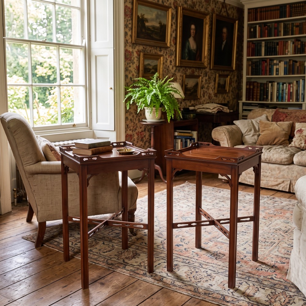 A pair of dark mahogany Edwardian side tables with square tops, pierced fretwork galleries, and cross stretchers. View II
