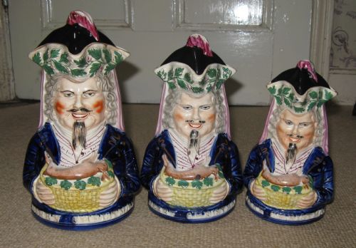 Rare Set of Three Graduated 'Merry Christmas' Staffordshire Toby Jugs C1860