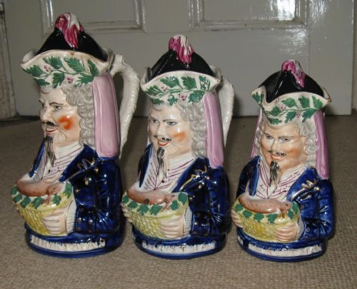 fig 1. RARE SET OF THREE GRADUATED 'MERRY CHRISTMAS' STAFFORDSHIRE TOBY JUGS c1860