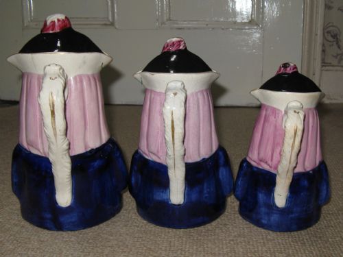 fig 2. RARE SET OF THREE GRADUATED 'MERRY CHRISTMAS' STAFFORDSHIRE TOBY JUGS c1860