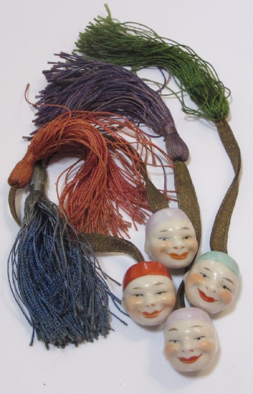 Four Continental Porcelain Oriental Faces on Silk Tassels C1910
