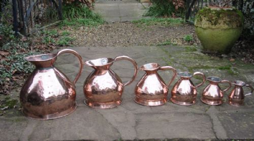 fig 1. SIX GRADUATED ANTIQUE COPPER MEASURES