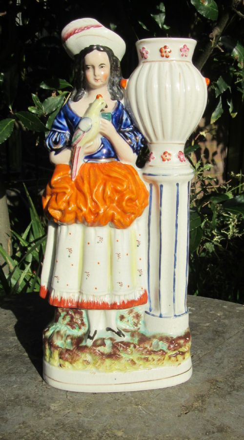 Staffordshire Figure of Girl with Parrot by Garden Urn