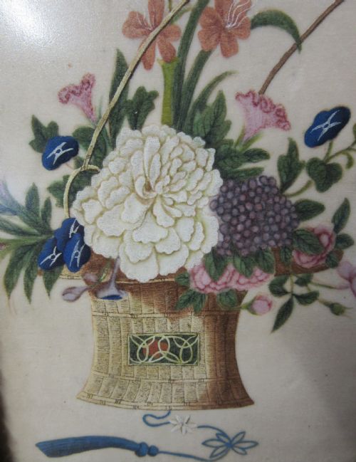 fig 1. A 19th-century Chinese painting showing a woven basket filled with flowers inside a moulded gilt frame.