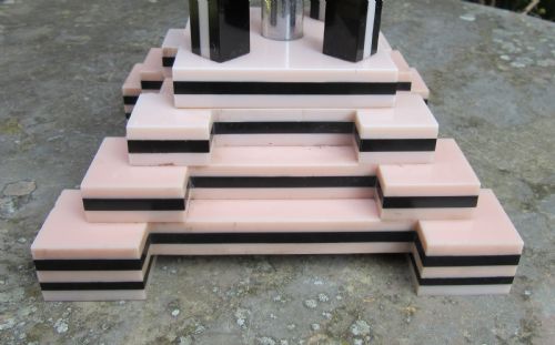 fig 1. An Art Deco table lamp base featuring a stepped ziggurat foundation and vertical black and pink layered columns.