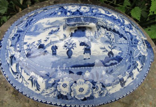 fig 1. An antique 1830 Staffordshire earthenware tureen featuring blue and white Chinoiserie transferware decoration with a matching lid and side handles.