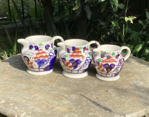 Set 3 Graduated Copper Lustre Jugs C1880