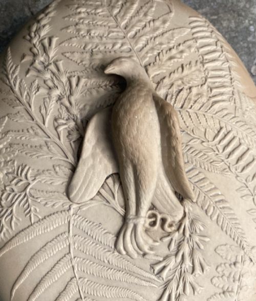 fig 1. A 19th-century buff caneware game pie dish featuring raised fern leaf decoration around the body and lid with a game bird finial.