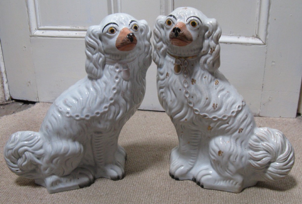 PAIR OF STAFFORDSHIRE WHITE & GILT DOGS circa 1860