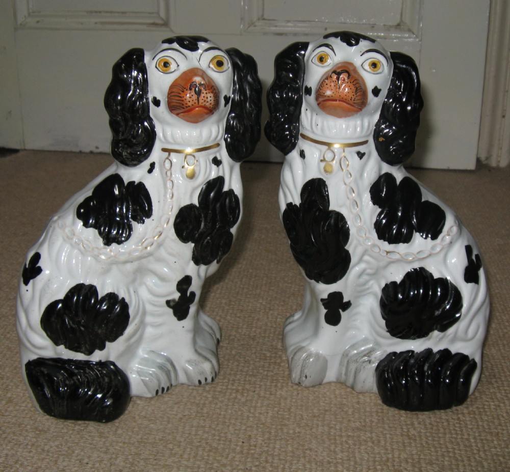PAIR OF STAFFORDSHIRE BLACK & WHITE DOGS circa 1860