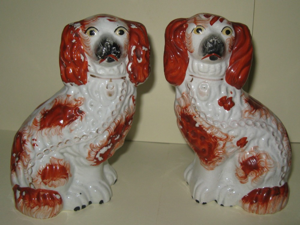 PAIR OF VICTORIAN STAFFORDSHIRE RED & WHITE SPANIELS c1860