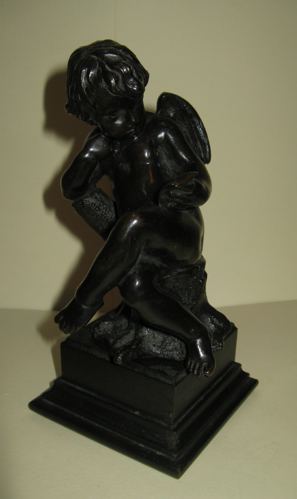 VICTORIAN BRONZE SEATED PUTTI circa 1880