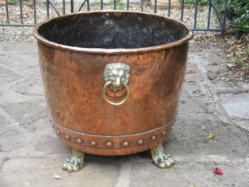 19th CENTURY COPPER LOG BIN WITH LION MASK HANDLES AND PAW FEET
