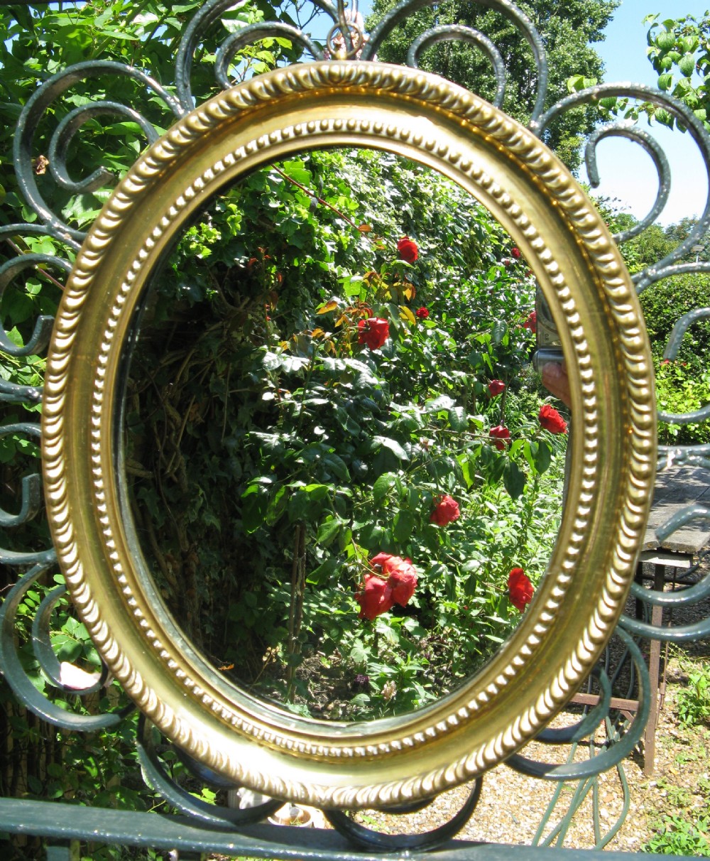 VICTORIAN PRESSED BRASS OVAL MIRROR c1860