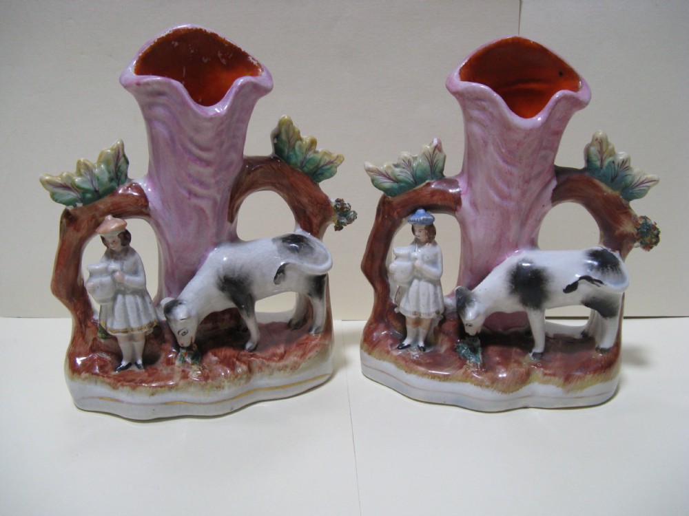 TWO STAFFORDSHIRE COW AND MILKMAID SPILL VASES c1860
