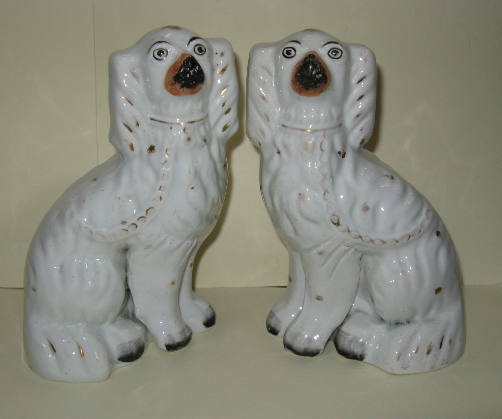 PAIR OF ANTIQUE STAFFORDSHIRE WHITE & GILT DOGS c1860
