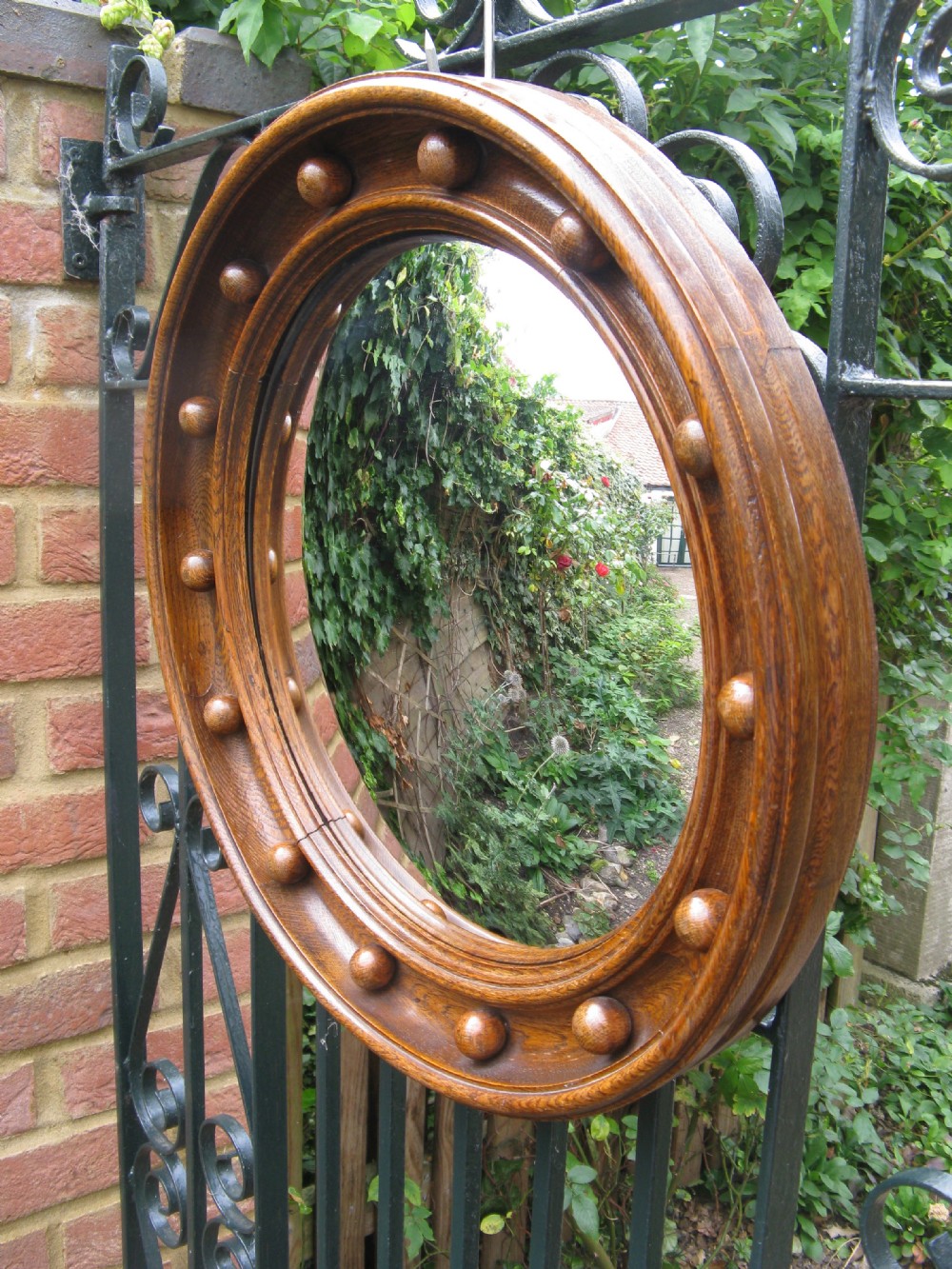 UNUSUAL SOLID OAK CONVEX or BUTLER'S MIRROR c1920