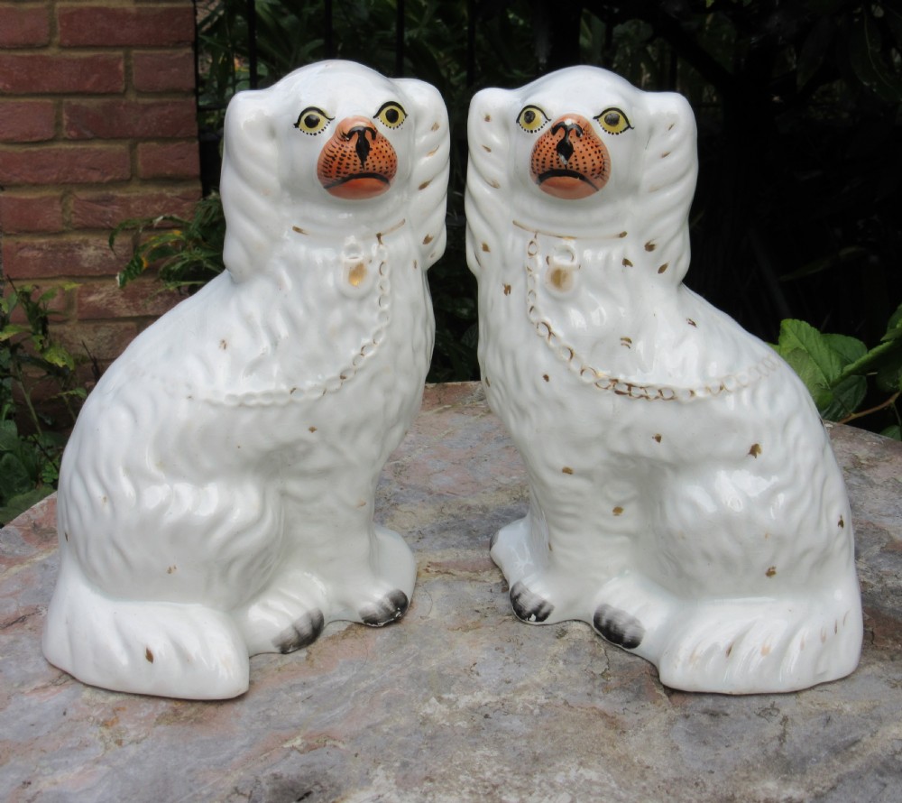 PAIR OF VICTORIAN WHITE & GILT STAFFORDSHIRE DOGS 