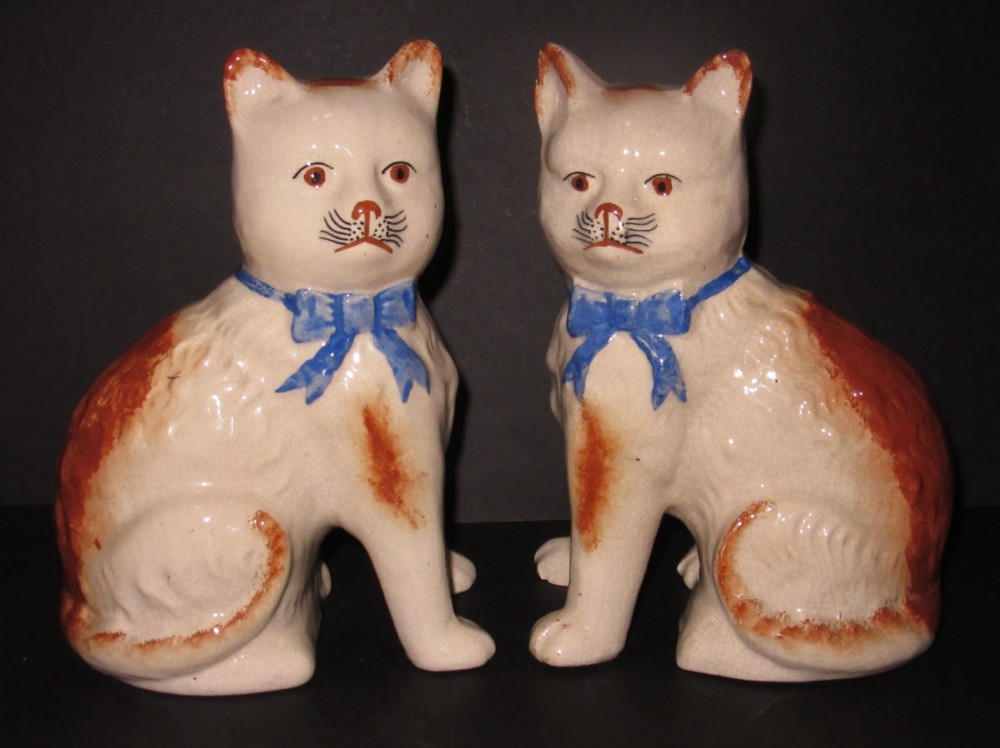 PAIR OF STAFFORDSHIRE POTTERY CATS c1920