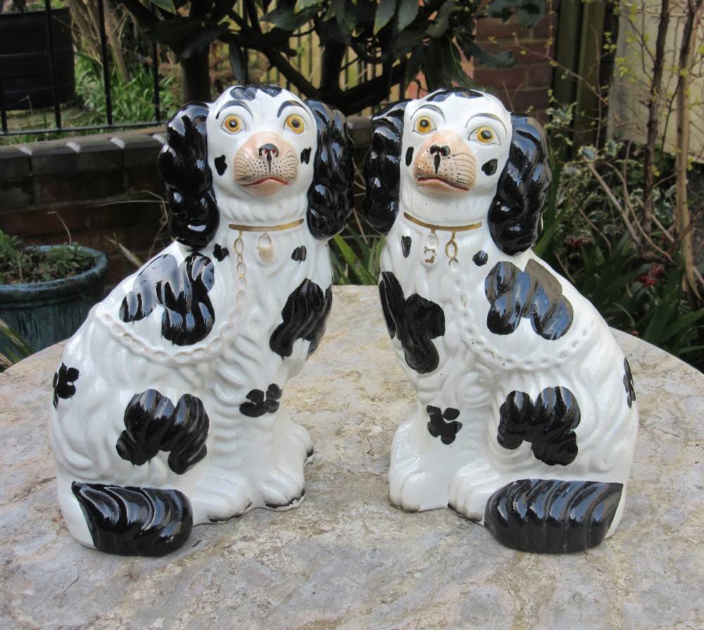 PAIR OF STAFFORDSHIRE BLACK & WHITE SPANIELS c1860