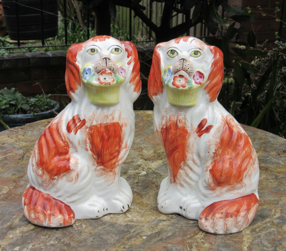 PAIR OF RED & WHITE STAFFORDSHIRE DOGS WITH BASKETS c1860