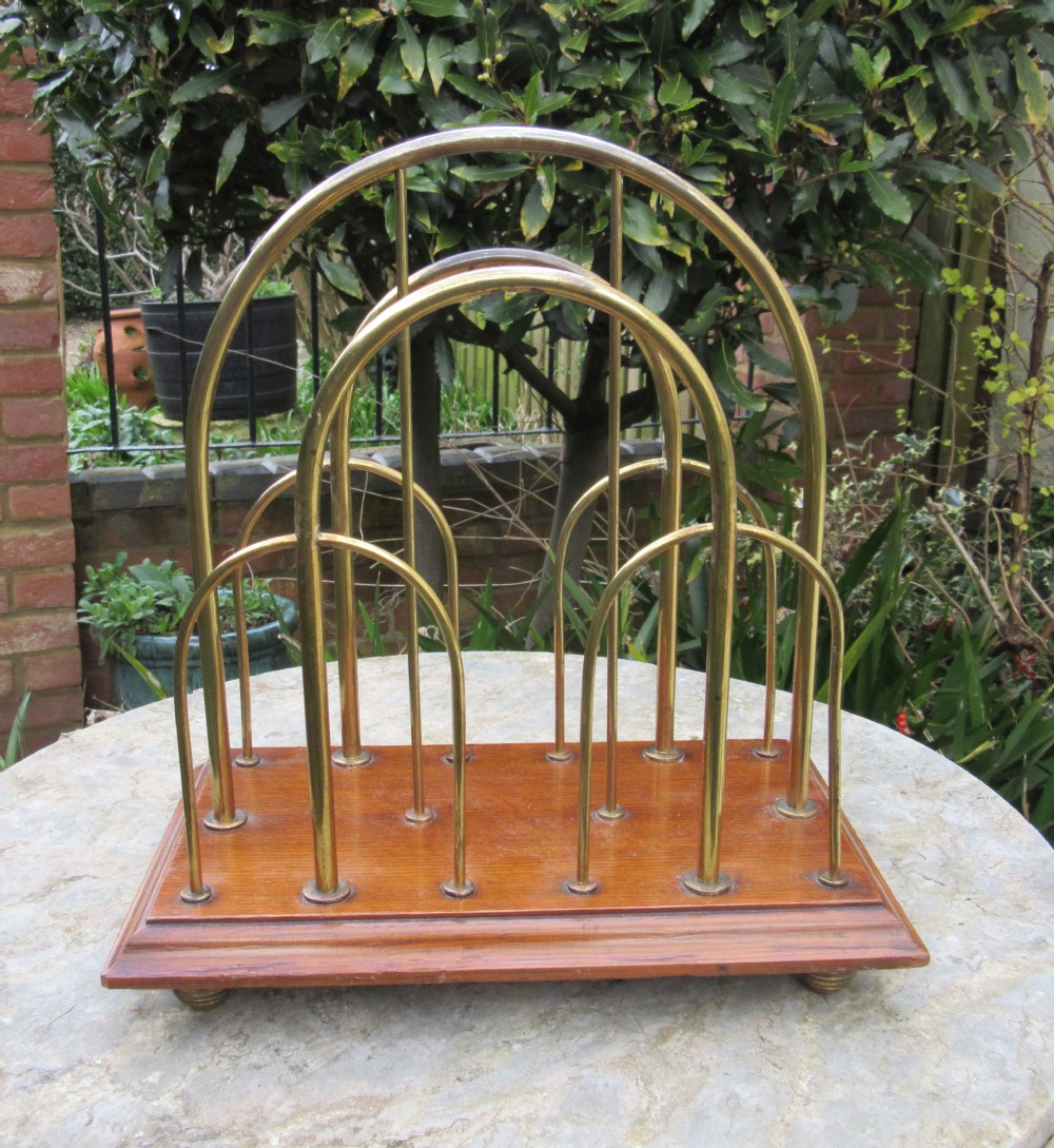 EDWARDIAN OAK AND BRASS MAGAZINE RACK c1910