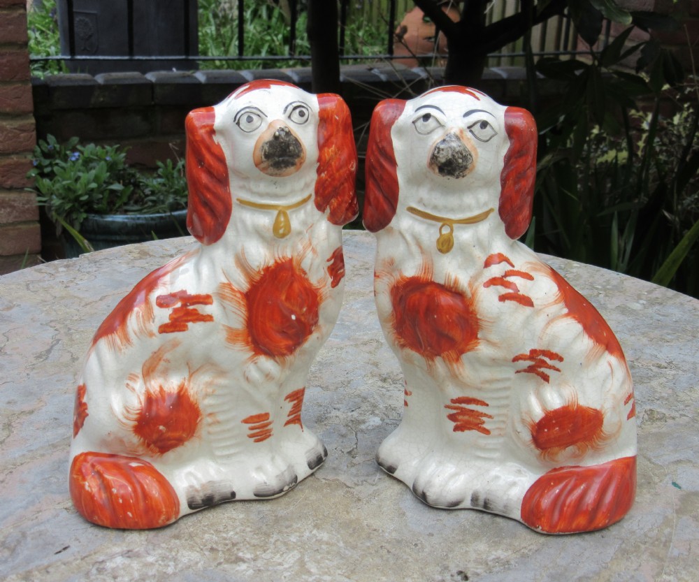 PAIR OF STAFFORDSHIRE RED & WHITE SPANIELS c1860