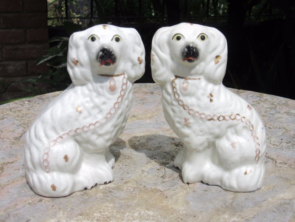 PAIR OF VICTORIAN STAFFORDSHIRE WHITE & GILT DOGS c1860