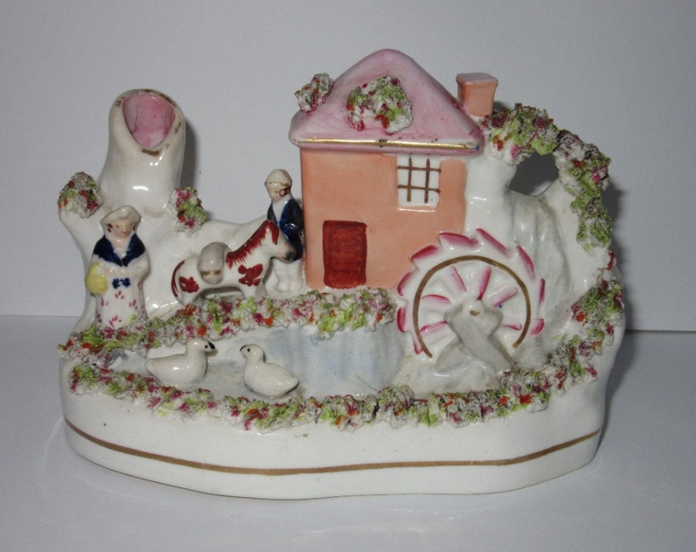 UNUSUAL STAFFORDSHIRE FIGURE OF MILLER & WIFE c1860