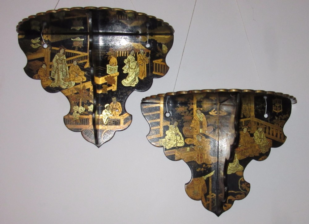 PAIR OF FOLDING LACQUERED PAPIER MACHE WALL BRACKETS c1880