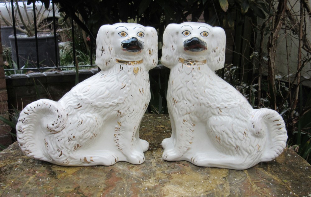 PAIR OF STAFFORDSHIRE WHITE & GILT DOGS c1880