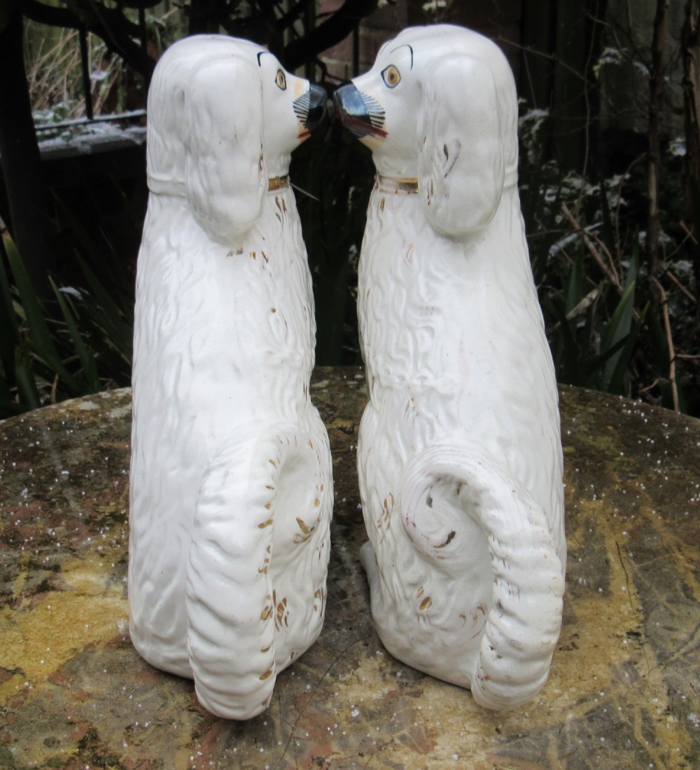 PAIR OF STAFFORDSHIRE WHITE & GILT DOGS c1880 View II