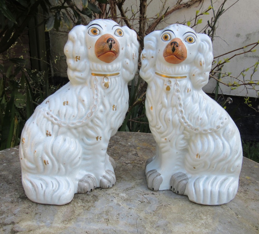 PAIR OF VICTORIAN WHITE STAFFORDSHIRE DOGS c1860