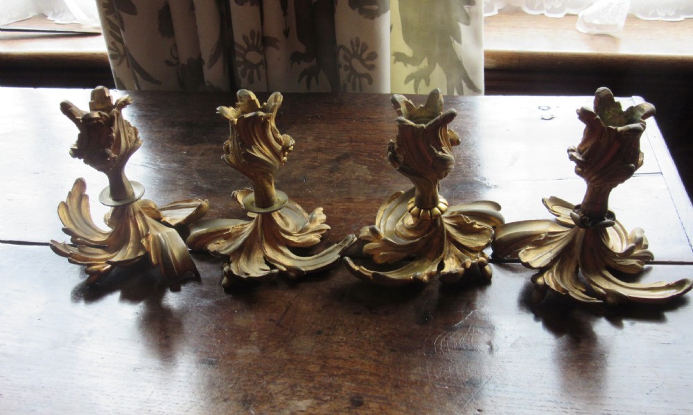 FOUR 19th CENTURY ORMOLU GILT METAL CANDLESTICKS View II