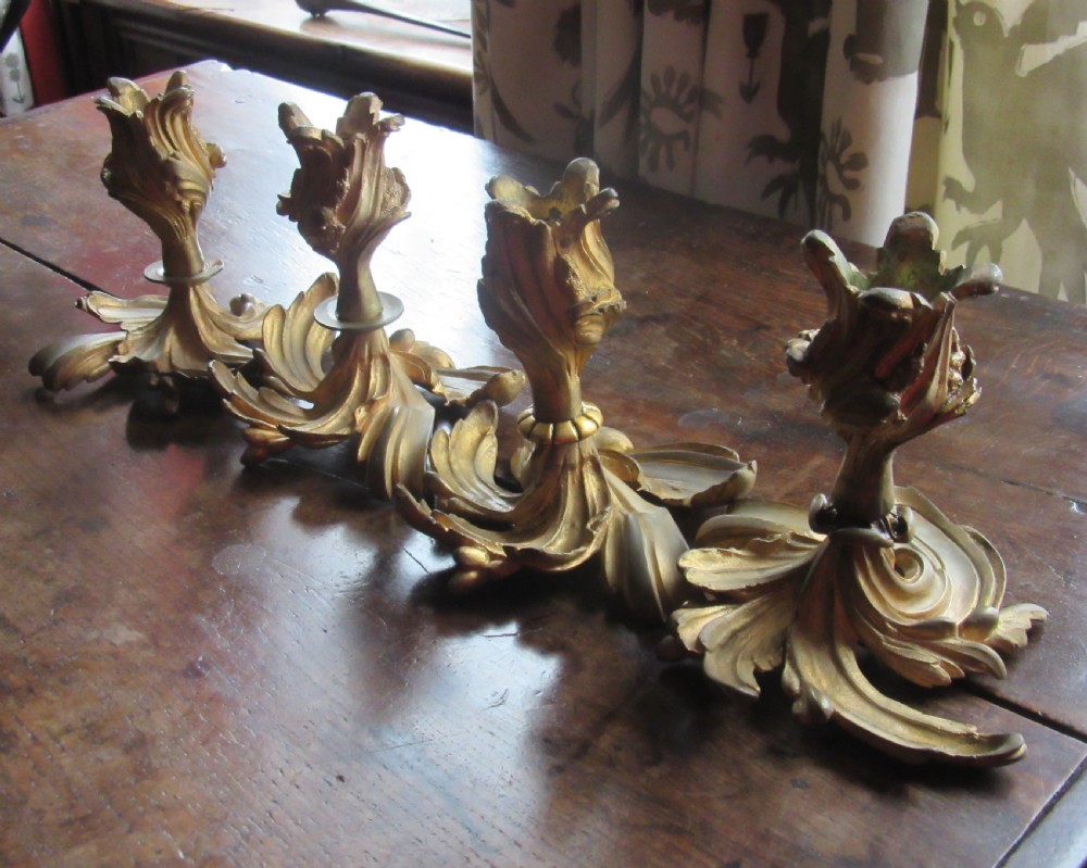 FOUR 19th CENTURY ORMOLU GILT METAL CANDLESTICKS View III
