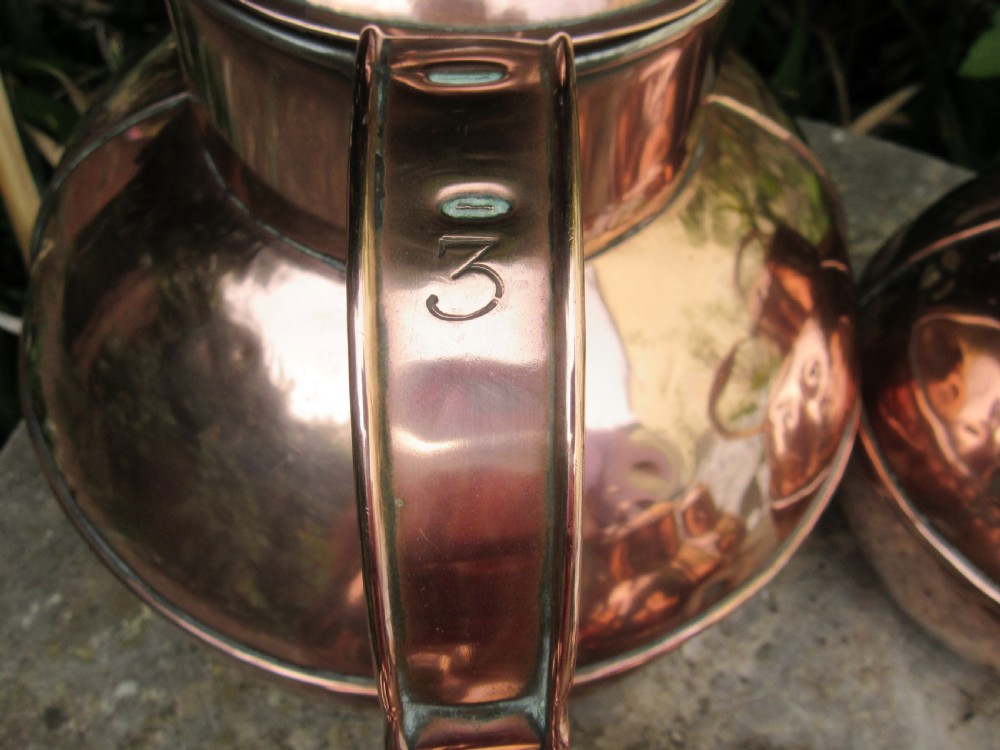 FIVE GRADUATED MARTIN'S GUERNSEY COPPER MILK JUGS  View II