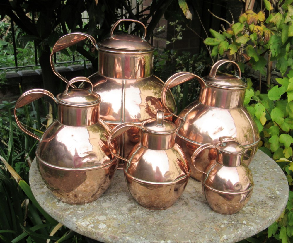 FIVE GRADUATED MARTIN'S GUERNSEY COPPER MILK JUGS  View VII