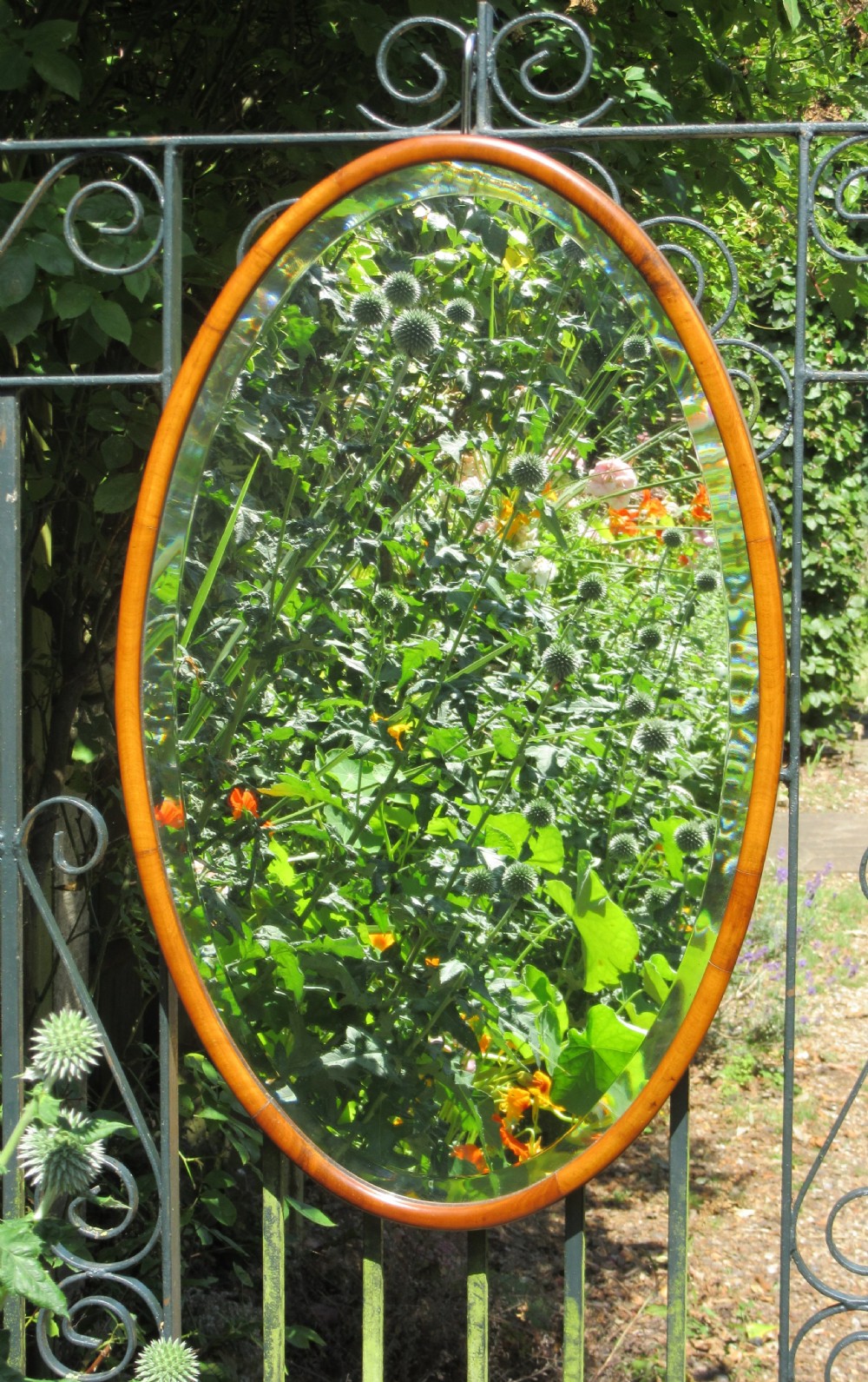 EDWARDIAN OVAL WALNUT WALL MIRROR c1910